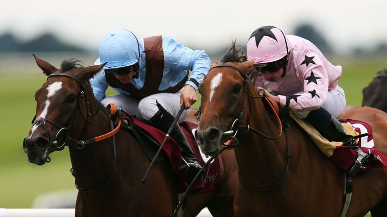Mango Diva, ridden by Ryan Moore (right), on her way to winning the Kilboy Estate Stakes.