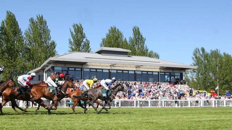 Riders and Horses pass the stand during the Crabbie's Alcoholic Ginger Beer Intermediate Handicap Hurdle during day two of the Perth Festival at Perth Race