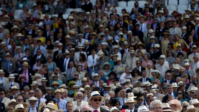 The crowd watch the Goodwood stakes during day two of Glorious Goodwood at Goodwood Racecourse, West Sussex.