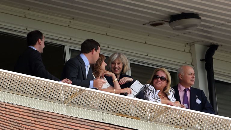 Home Security Theresa May (centre) during The Beach Boys Party in the Paddock Day at Newbury Racecourse, Newbury.