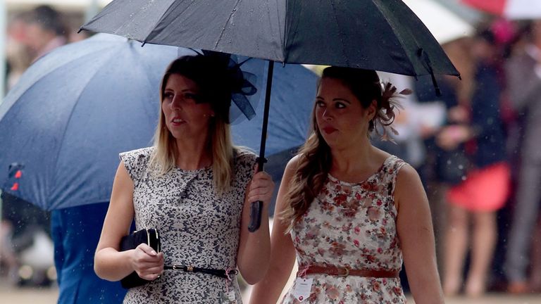 Ladies brave the rain during the Boylesports Ladies Day of the July Festival at Newmarket Racecourse.