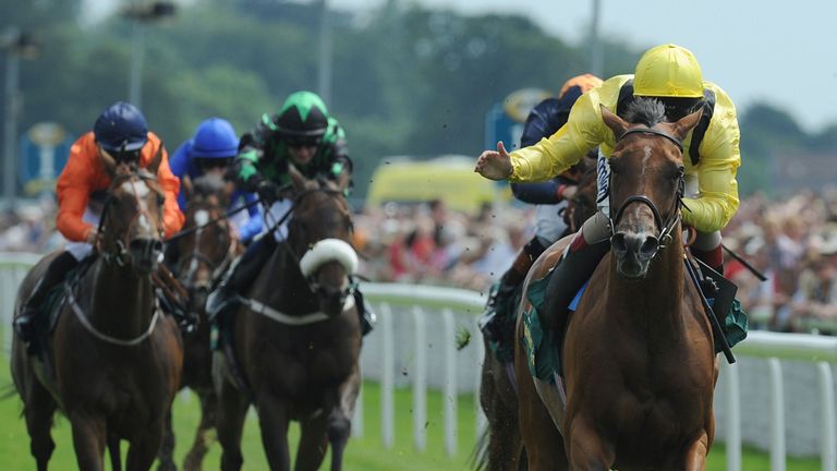 Farraaj earns a pat down the neck from Andrea Atzeni after taking the John Smith's Cup.