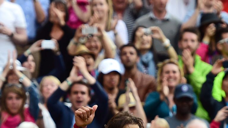 Rafael Nadal waves as he leaves the court after losing at Wimbledon