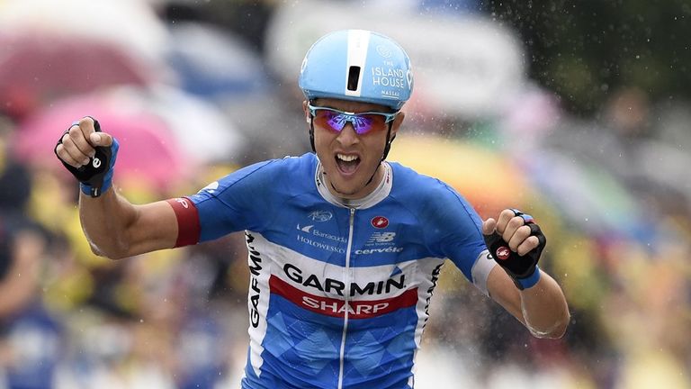 Ramunas Navardauskas celebrates as he crosses the finish line at the end of the 208.5 km nineteenth stage of the 101st edition of the Tour de France 