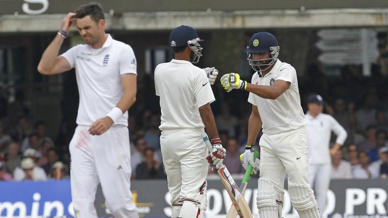 India batsmen Ravindra Jadeja (R) and Bhuvneshwar Kumar (C) and England bowler James Anderson (L). 2nd Test, Lord's. July 20 2014.