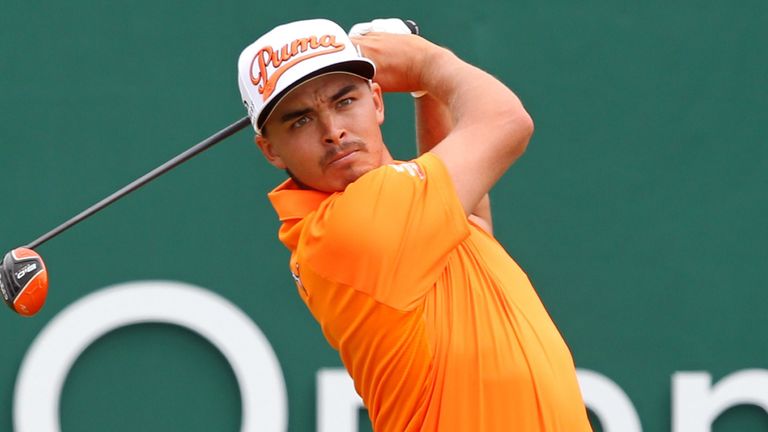 Rickie Fowler, in final-round orange, was McIlroy's closest challenger at the start of their final round