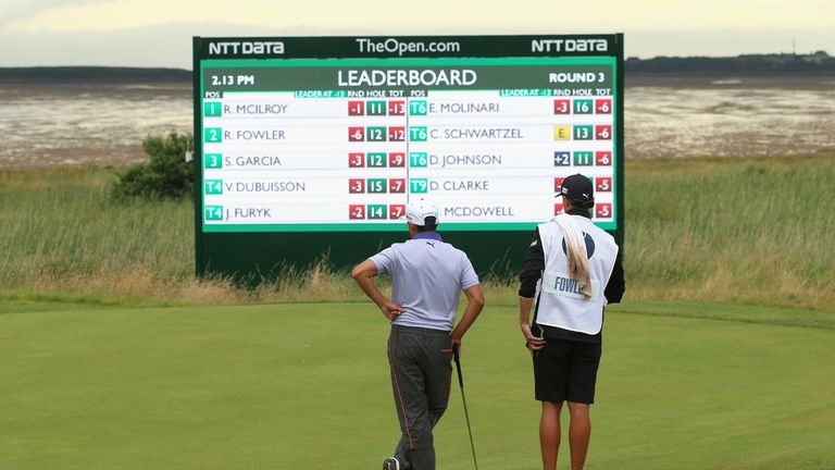 Rickie Fowler looks at the leaderboard at the Open Championship at Royal Liverpool