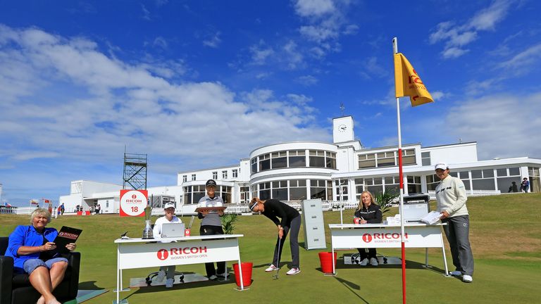 SOUTHPORT, ENGLAND - JULY 07:  Michelle Wie of the USA the 2014 US Open Champion practices her putting in front of (left to right) Laura Davies of England,