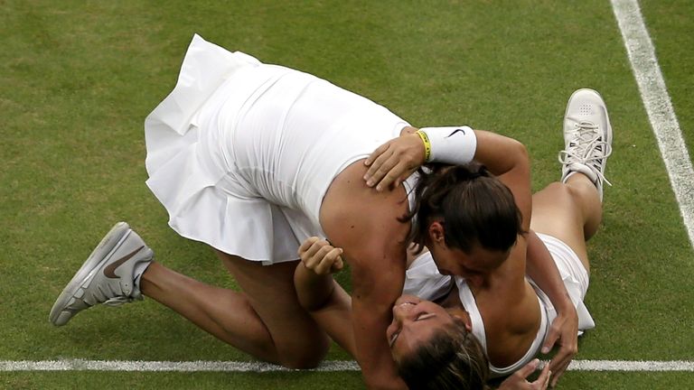 Roberta Vinci (top) and Sara Errani of Italy celebrate winning their Ladies Doubles Final match at Wimbledon