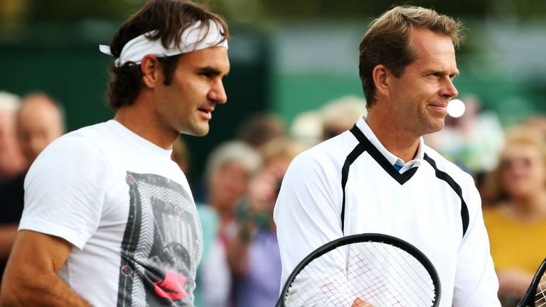 Roger Federer of Switzerland talks with his coach Stefan Edberg during a practice session
