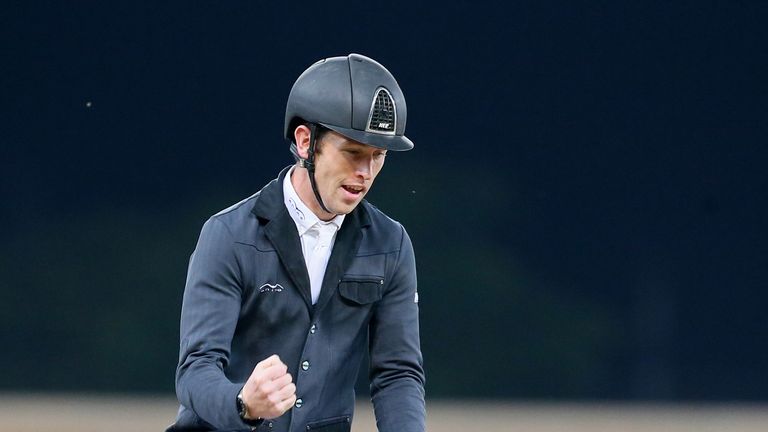 Scottish showjumper Scott Brash celebrates after winning in the final day of the Longines Global Champions Tour at Al-Shaqab Arena in the Qatari capital Do