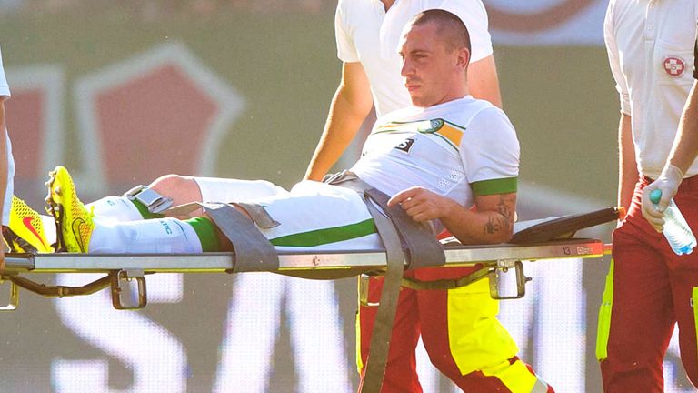 Scott Brown: Celtic skipper is carried off the pitch after suffering a hamstring injury