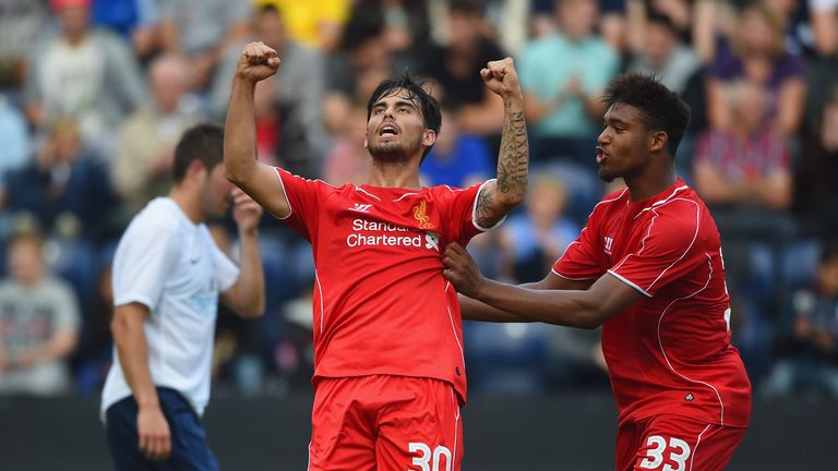 Suso of Liverpool celebrates scoring with team-mate Jordan Ibe during the pre-season friendly match between Preston North End and Liverpool at Deepdale
