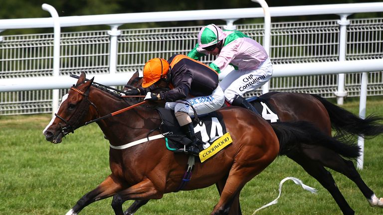 CHICHESTER, ENGLAND - JULY 30: Silvestre De Sousa riding Teak (orang cap) comes through to win The Goodwood Stakes at Goodwood racecourse on July 30, 2014 