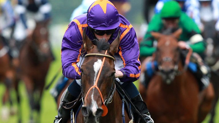 ASCOT, ENGLAND - JUNE 23:  Ryan Moore (Purple, orange) riding Simenon win The Queen Alexandra Stakes on day five of Royal Ascot at Ascot racecourse on June