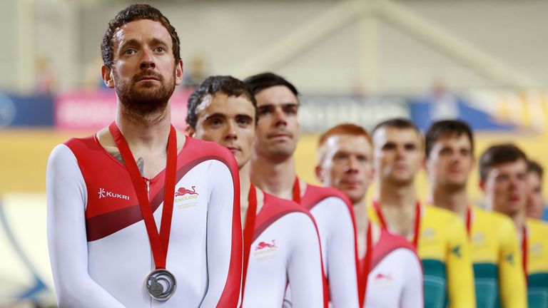 Sir Bradley Wiggins stands on the podium after receiving a silver medal in the mens 400m Team Pursuit at the Sir Chris Hoy Velodrome