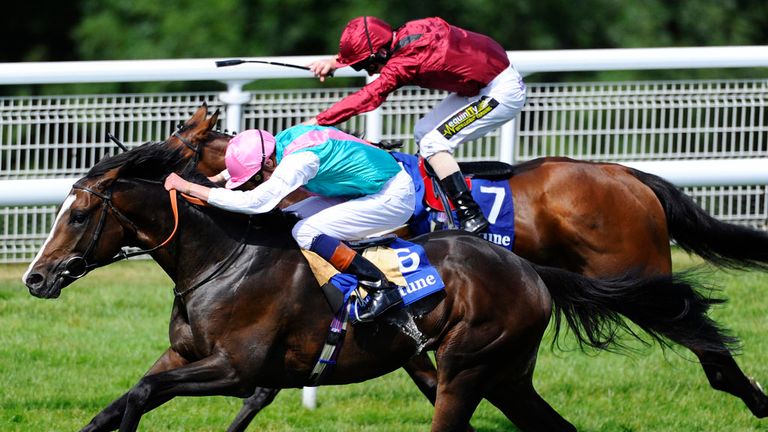 CHICHESTER, ENGLAND - JULY 30:  James Doyle riding Snow Sky (nearest) win The Neptune Investment Management Gordon Stakes at Goodwood racecourse on July 30