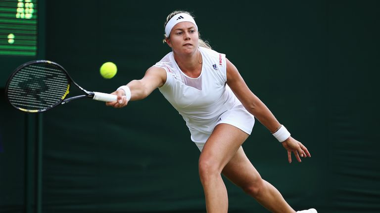 Stefanie Voegele of Switzerland in action during Wimbledon
