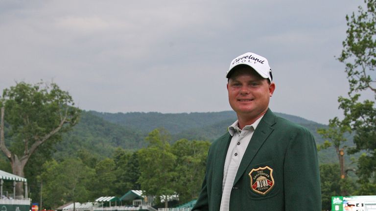Ted Potter, Jr. stands with the championship trophy after winning the Greenbrier Classic at the Old White TPC on July 8