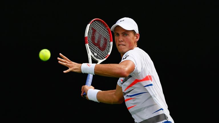 Vasek Pospisil of Canada returns a forehand to Illya Marchenko of the Ukraine during the BB&T Atlanta Open at Atlantic Station 