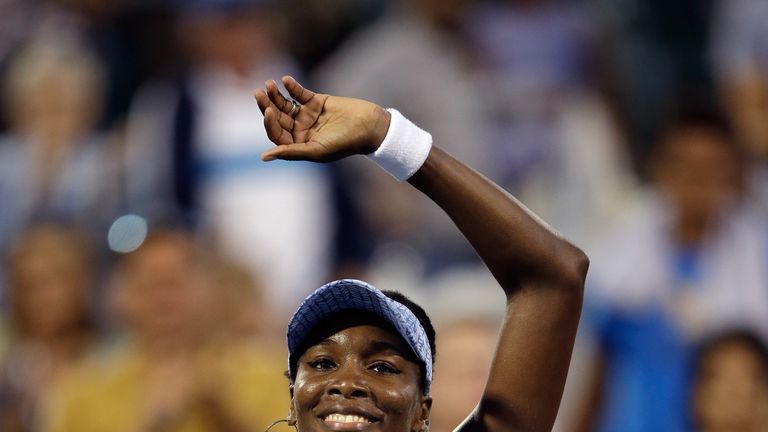 Venus Williams waves to the crowd after beating Paula Kania of Poland