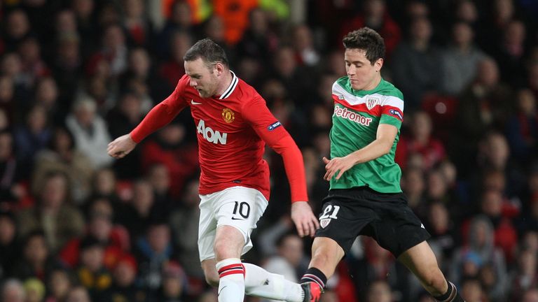 Wayne Rooney of Manchester United and Ander Herrera of Athletic Bilbao at Old Trafford on March 8, 2012 in Manchester, England.