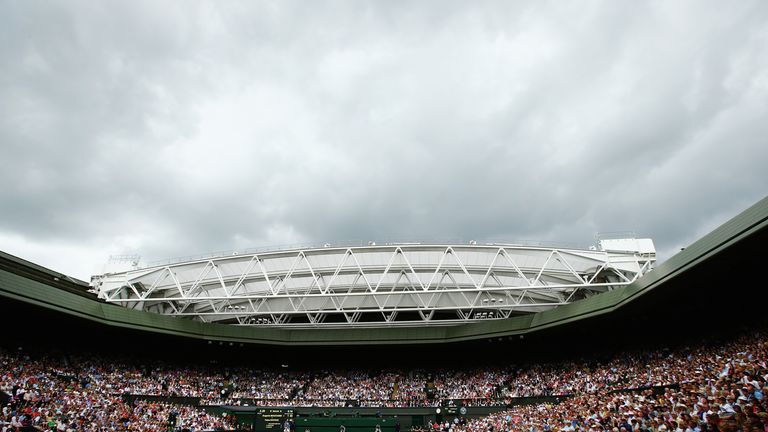 A packed centre court watches on as Bouchard serves against Kvitova