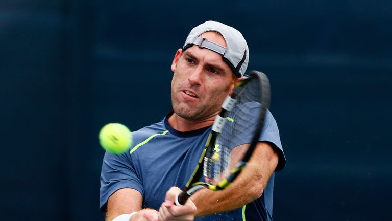 Robby Ginepri returns a backhand to Sergiy Stakhovsky of the Ukraine during the BB&T Atlanta Open at Atlantic Station on July 22, 2