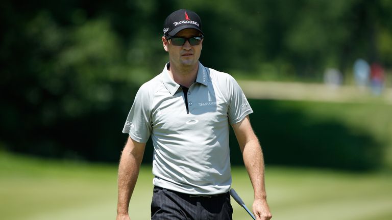 Zach Johnson walks off the ninth green after his first round of the John Deere Classic held at TPC Deere Run on July 10, 2014
