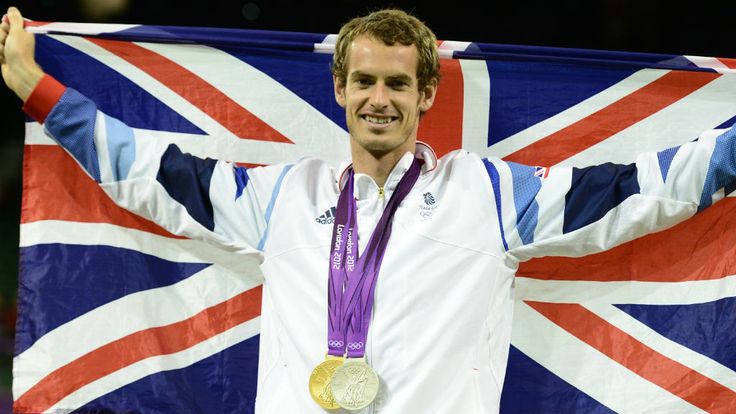 Andy Murray poses with his gold medal in the men's single tournament and the silver, won in the mixed doubles at the 2012 Olympics