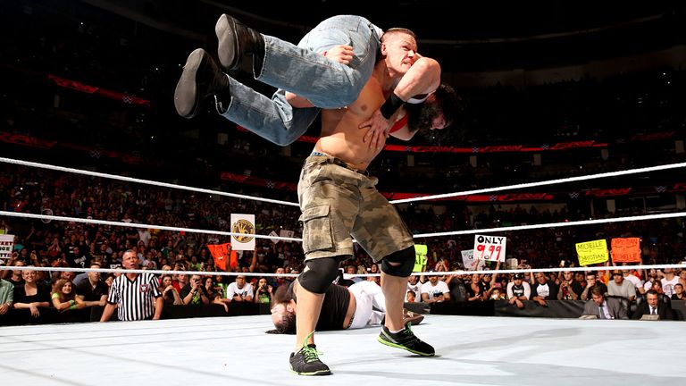 John Cena prepares to give Luke Harper an Attitude Adjustment