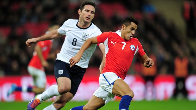 Alexis Sanchez of Chile goes past Frank Lampard of England during the international friendly match between England and Chile