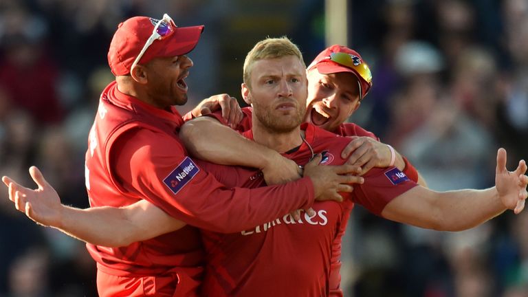 **ALTERNATIVE CROP** Lancashire Lightning's Andrew Flintoff celebrates with Ashwell Prince (left) and Steven Croft (right) after taking the wicket of Birmi