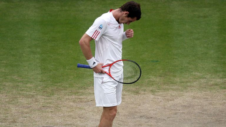 Andy Murray reacts during his Gentlemen's Singles final match against Roger Federer of Switzerland at Wimbledon 2012