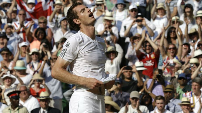 Britain's Andy Murray celebrates beating Serbia's Novak Djokovic in the 2013 Wimbledon men's final