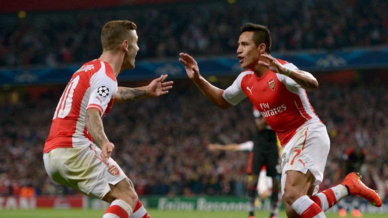Arsenal's Alexis Sanchez (right) celebrates scoring their first goal of the game with team-mate Jack Wilshere (left) 