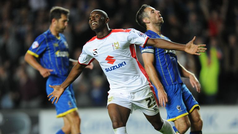 MK Dons striker Benik Afobe celebrates scoring their third goal during the Capital One Cup match against AFC Wimbledon at Stadium:MK, Milton Keynes