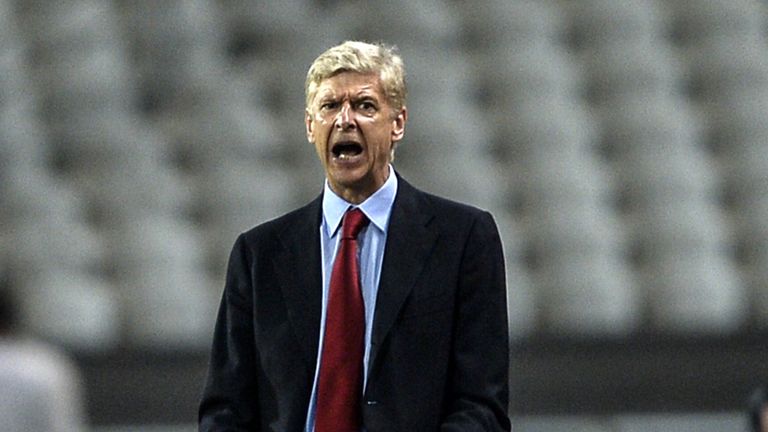 Arsenal's head coach Arsene Wenger reacts during the UEFA Champions League play-off first leg football match Besiktas vs Arsenal