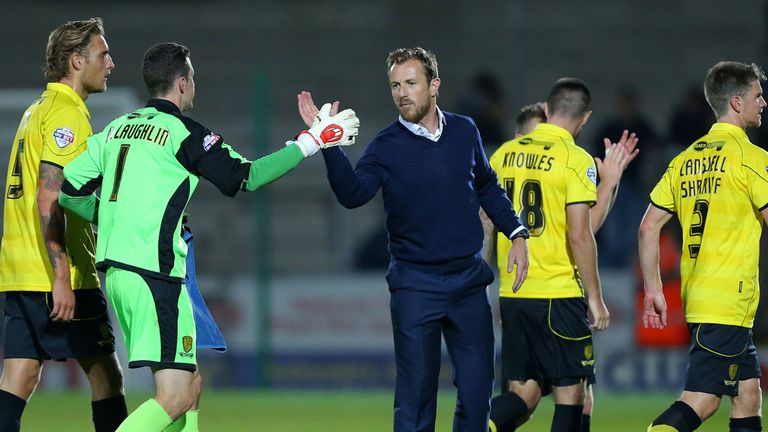 Burton Albion manager Gary Rowett congratulates his players after victory against Queens Park Rangers during the Capital One Cup Second Round match