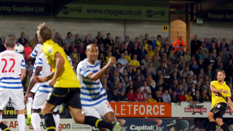 Burton Albion's Adam McGurk scores the first goal of the game during the Capital One Cup Second Round match at the Pirelli Stadium, Burton.