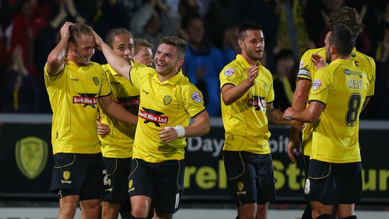Burton Albion???s Adam McGurk (left) celebrates scoring the first goal of the game during the Capital One Cup Second Round match at the Pirelli Stadium
