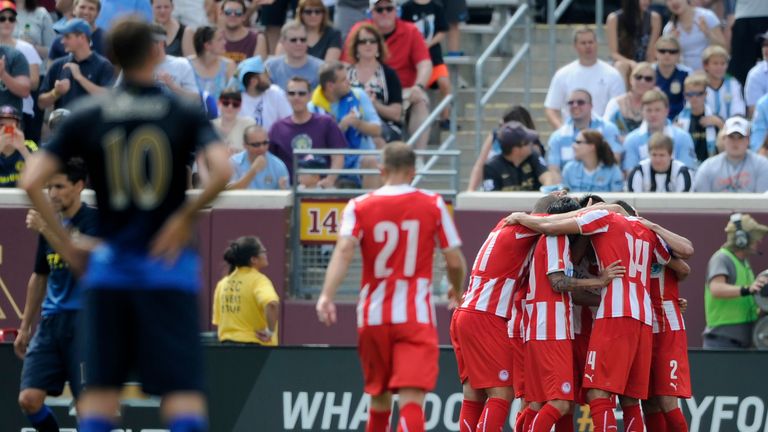 Edin Dzeko of Manchester City looks on as Olympiacos celebrates a goal during the first half of the International Champions Cup clash in Minneapolis