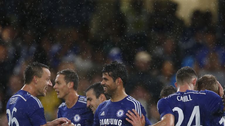 LONDON, ENGLAND - AUGUST 12: Diego Costa of Chelsea celebrates scoring his 2nd goal with his team mates during the pre-season friendly match between Chelse