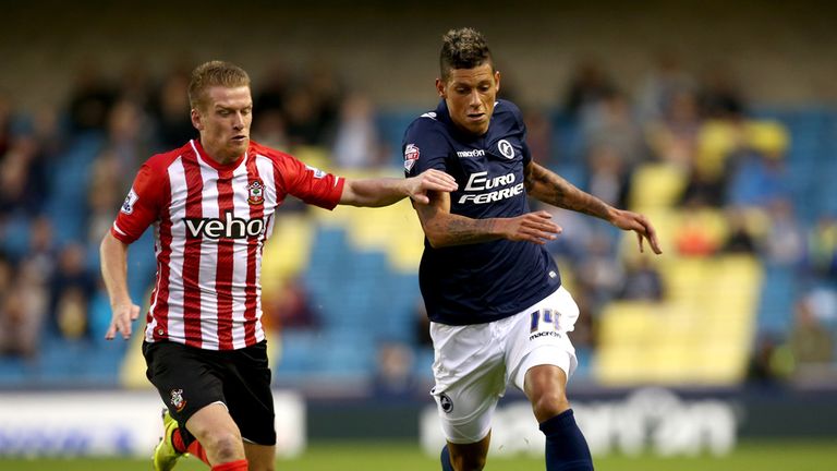 LONDON, ENGLAND - AUGUST 26:  Matthew Briggs of Millwall battles with Steven Davis of Southampton during the Capital One Cup Second Round match between Mil