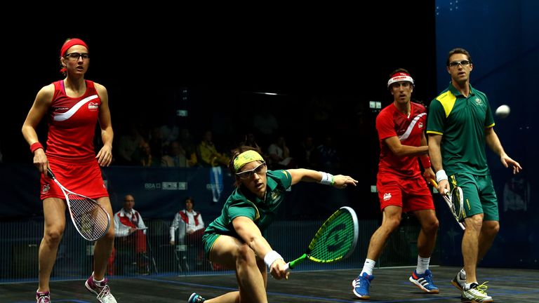 Rachael Grinham of Australia plays a shot in the gold medal match against England's Alison Waters and Peter Barker