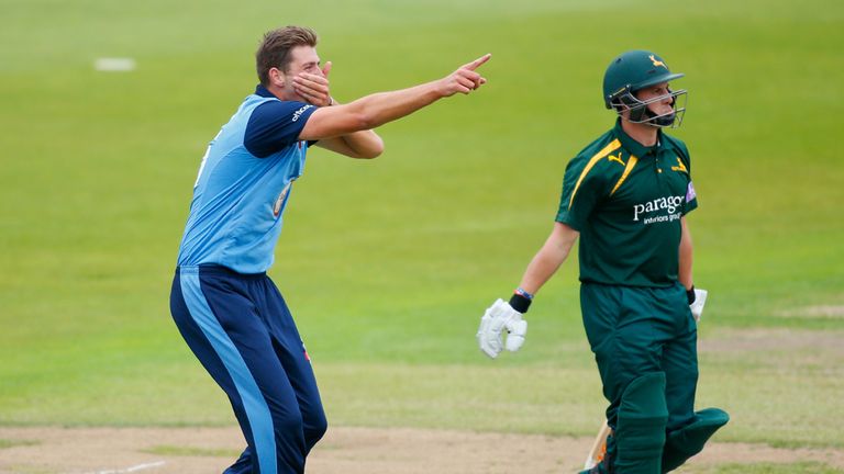 NOTTINGHAM, ENGLAND - AUGUST 26: Ben Cotton of Derbyshire celebrates dismissing Steven Mullaney of Nottinghamshire (R) during the Royal London One-Day Cup 