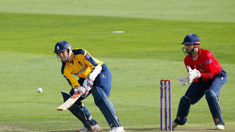 Rikki Clarke of Warwickshire hits out watched by Essex wicketkeeper James Foster during the Royal London One-Day Cup quarter-final at Chelmsford