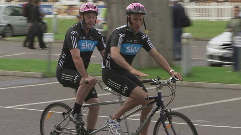 Bumble - sporting smart shoes - arrives with Nasser on a tandem