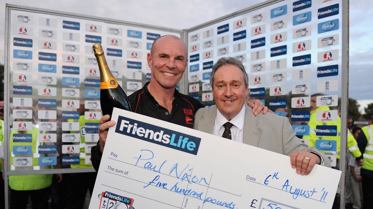 LEICESTER, ENGLAND - AUGUST 06:  Paul Nixon receives his man of the man of the match award from Chief Executive Mike Siddall after the Friends Life T20 Qua