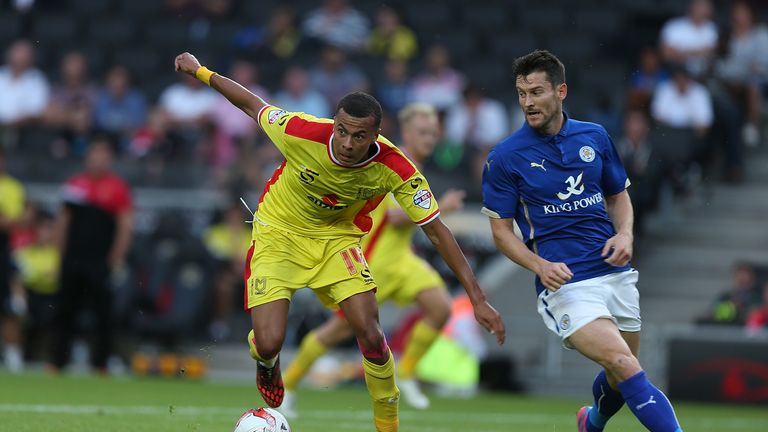 Dele Alli of MK Dons looks to control the ball watched by David Nugent of Leicester City during the Pre-Season Friendly